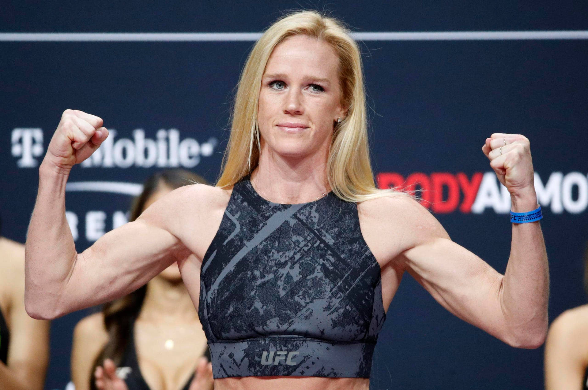[100+] Holly Holm Pictures | Wallpapers.com - Holly Holm Kicks High & Looks Hot: Sexy Fighter Photos