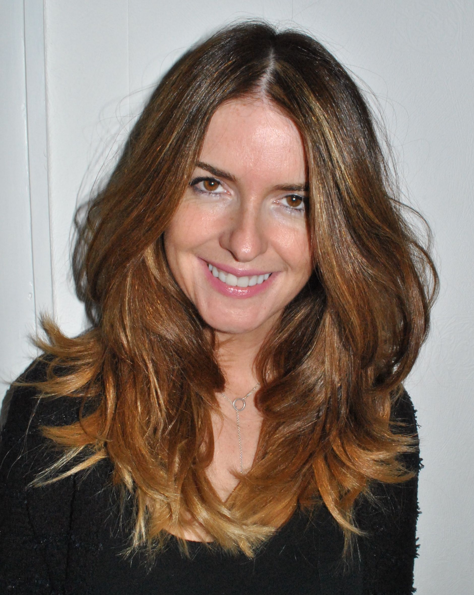 a woman with long brown hair smiling at the camera - Anne Marie Lodge: Sexy Pics of the Skincare Enthusiast Turning Heads