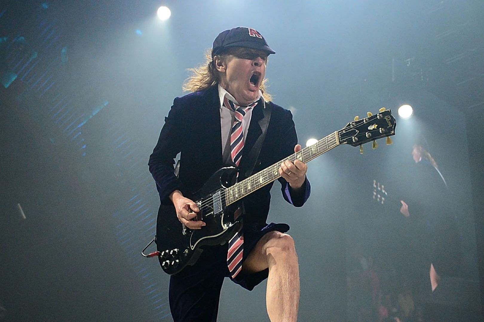 How Old Is Angus Young? AC/DC's Guitar Legend Then And Now