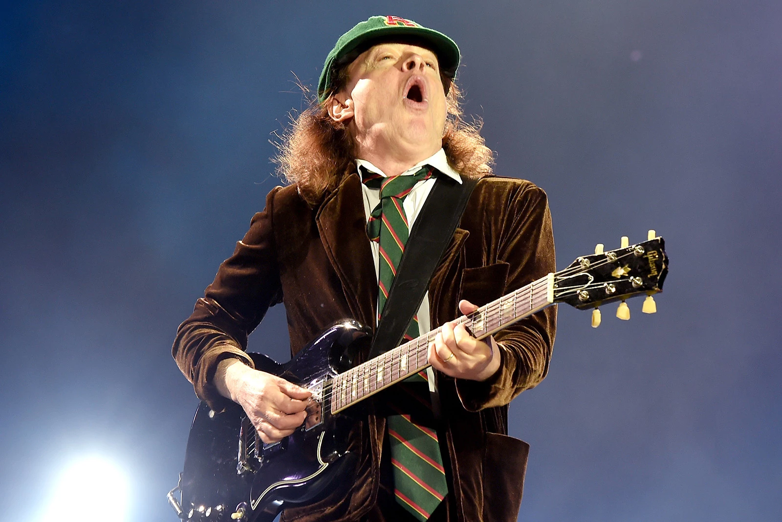 Angus Young News - How Old Is Angus Young? AC/DC's Guitar Legend Then And Now