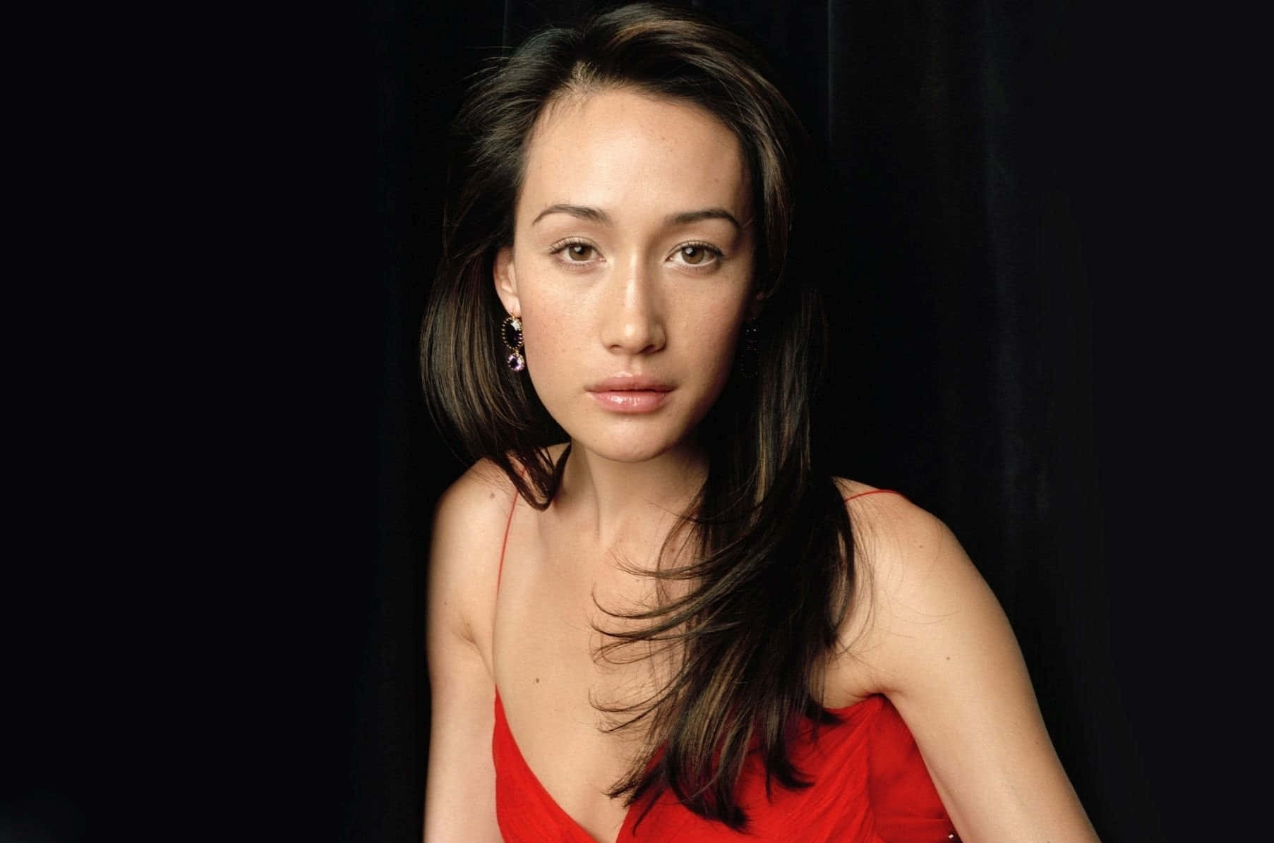 Download Actress Maggie Q Poses Elegantly Wallpaper | Wallpapers.com - Maggie Q's Model Stature: How Tall Is The Action Star?