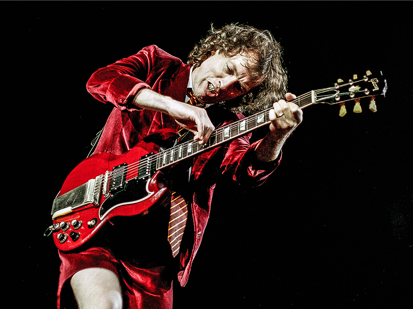 Five myths about Angus Young’s AC/DC guitar gear that people still believe - How Old Is Angus Young? AC/DC's Guitar Legend Then And Now