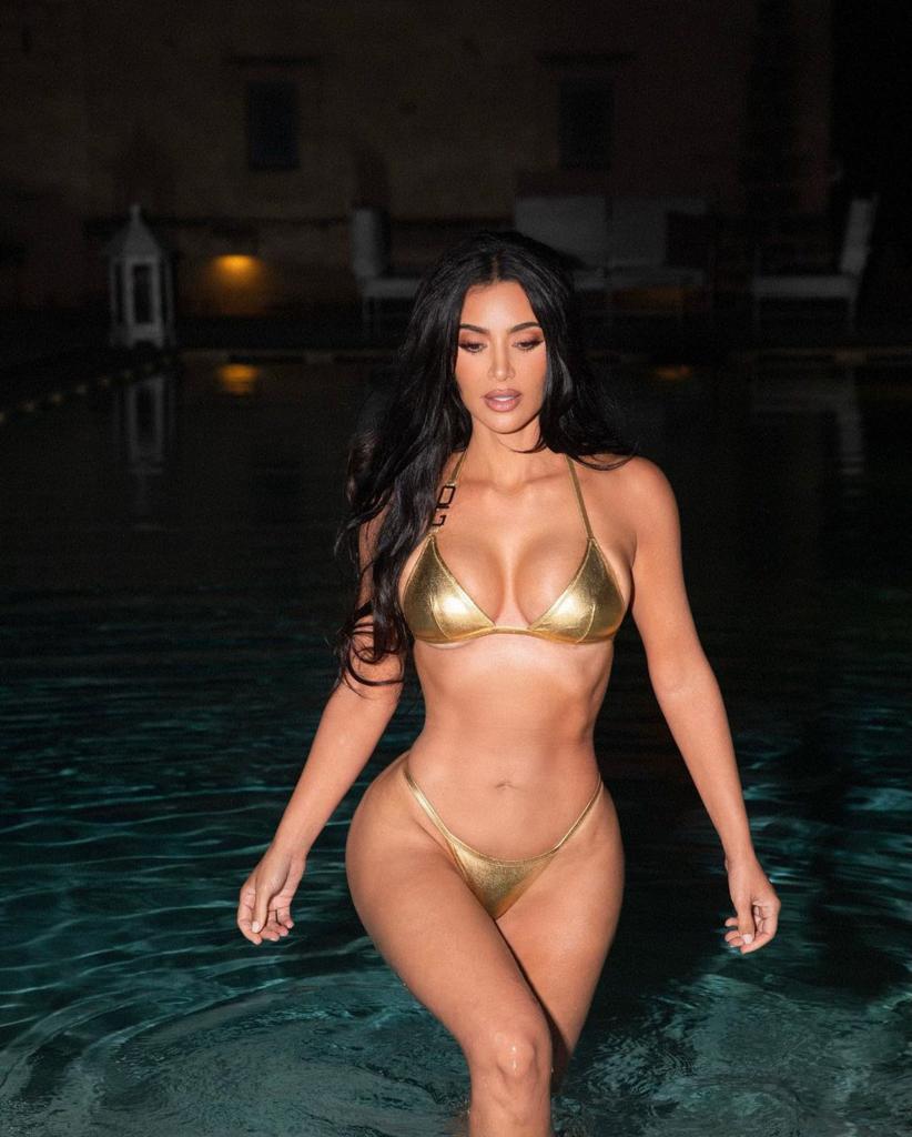 Kim Kardashian bikes in a gold bikini in sexy 'night swim' snaps - Kim Kardashian’s Iconic Fashion Moments – Reality Queen Turned Fashion Mogul