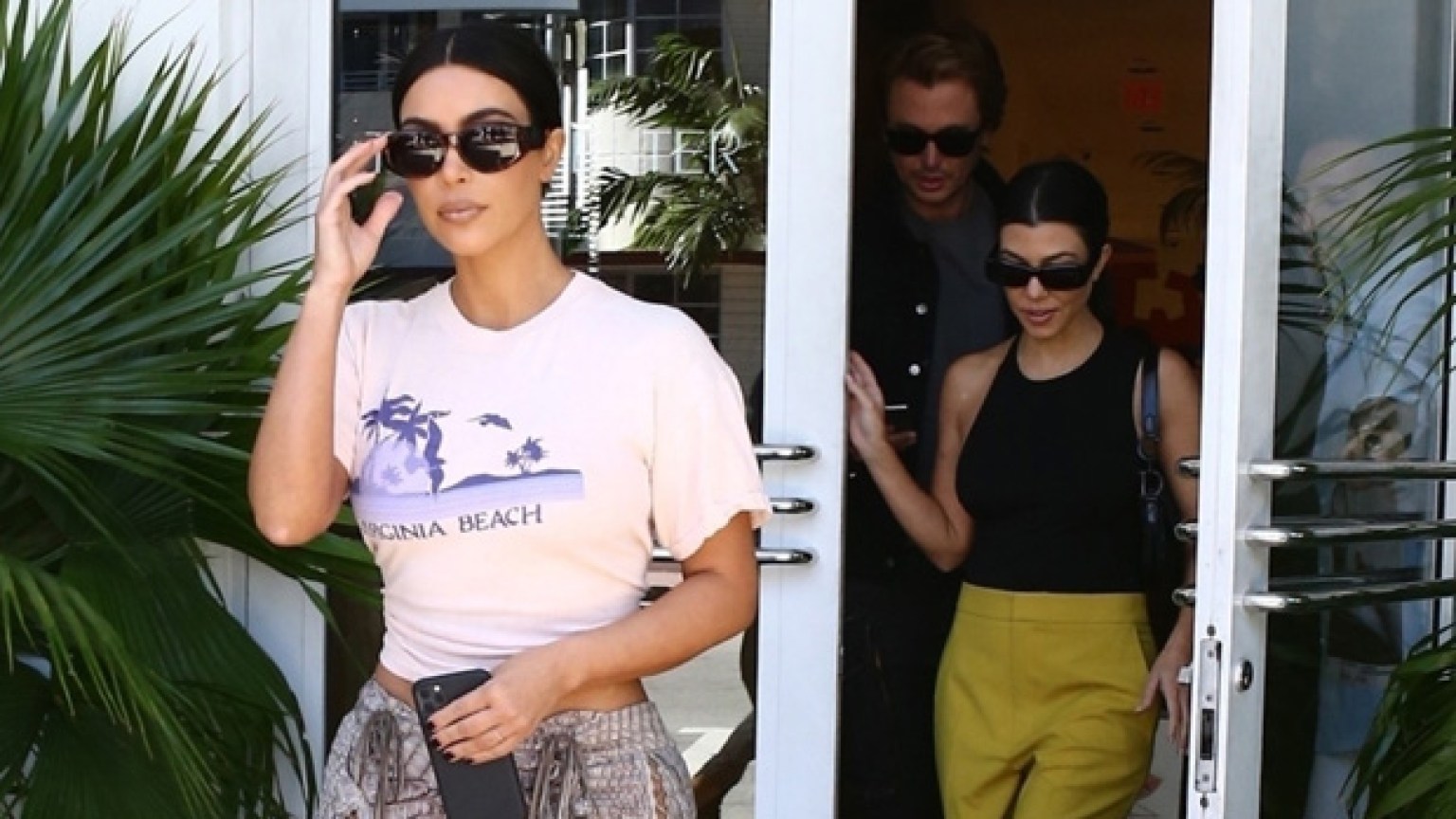Kim Kardashian Knots Her T-Shirt & Shows Off Her Famous Backside: Pic - Kim Kardashian's Famous Curves: Measurements, Height & More