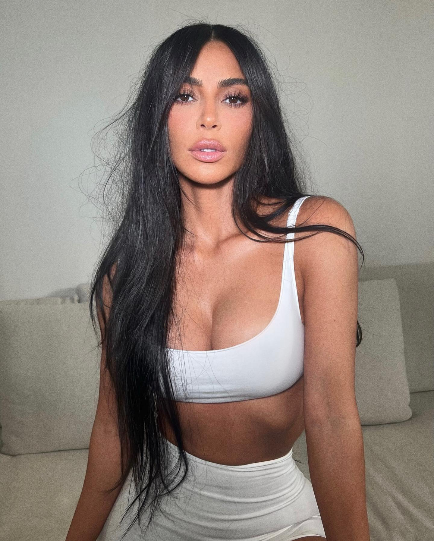 Kim Kardashian’s muscular abs pop out from her thin waist as she poses - Kim Kardashian’s Iconic Fashion Moments – Reality Queen Turned Fashion Mogul