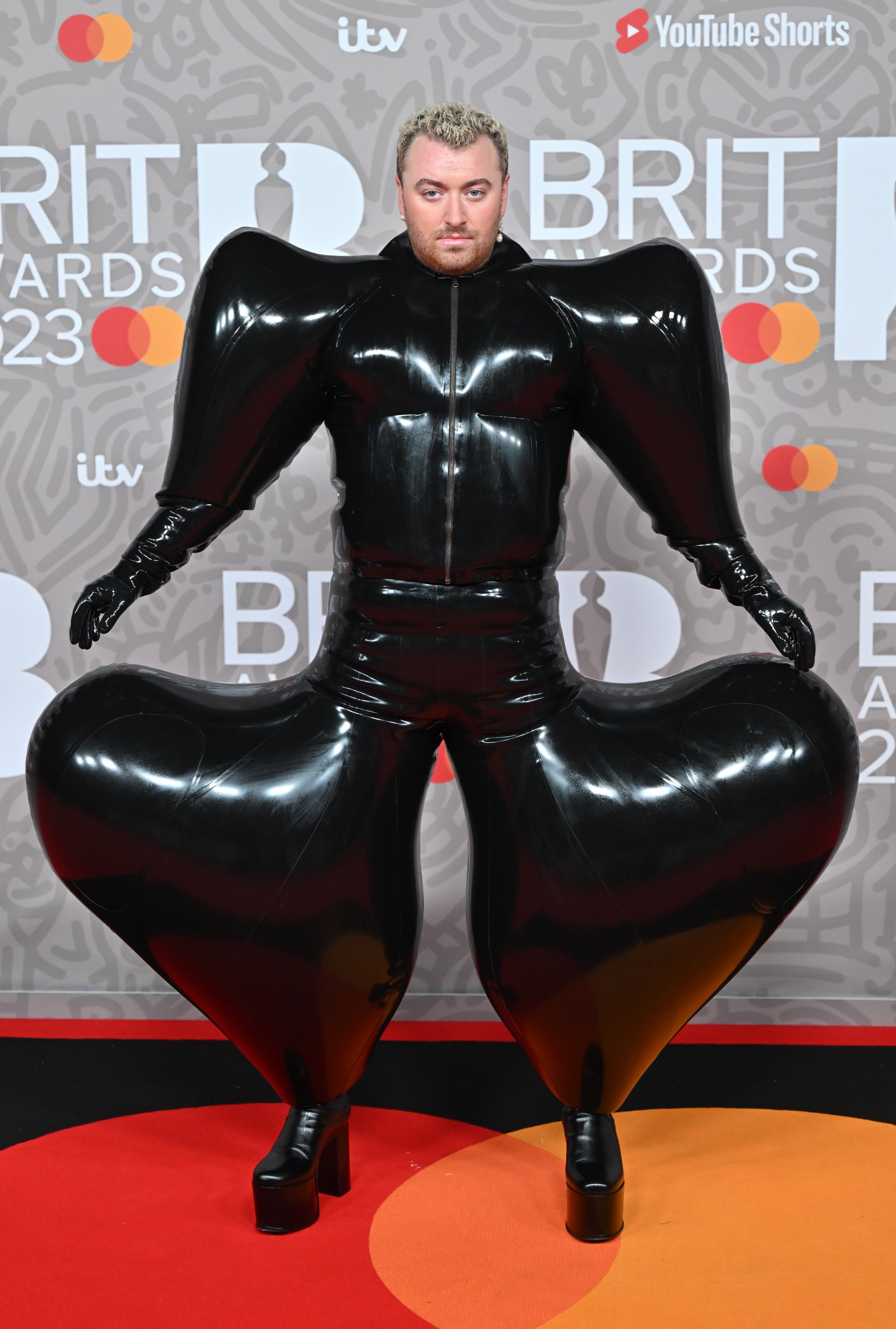 Sam Smith's Brit Awards 2023 Outfit, Explained: Red Carpet in Latex - Sam Fricker's Real Height – Diving Into the Numbers