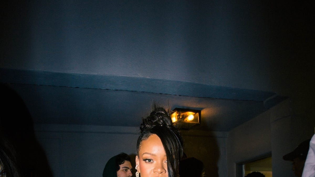 See Rihanna Support A$AP Rocky in an Oversized Bomber and Mini Skirt - Rihanna Stuns In Cut-Out Baby Blue Dress At A$AP Rocky’s Cannes Premiere