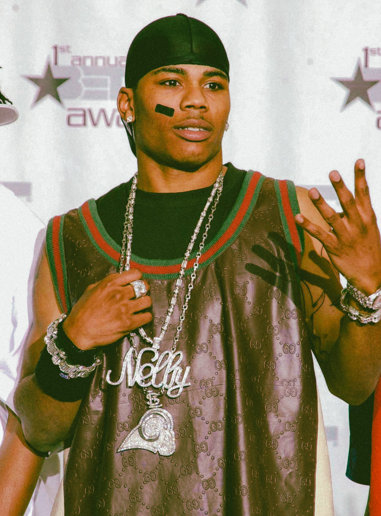 strappedarchives:Nelly photographed by Gregg DeGuire while attending - How Old Is Nelly? Hip-Hop Icon’s Age in 2025